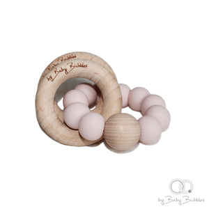Light pink silicone and hardwood baby rattle